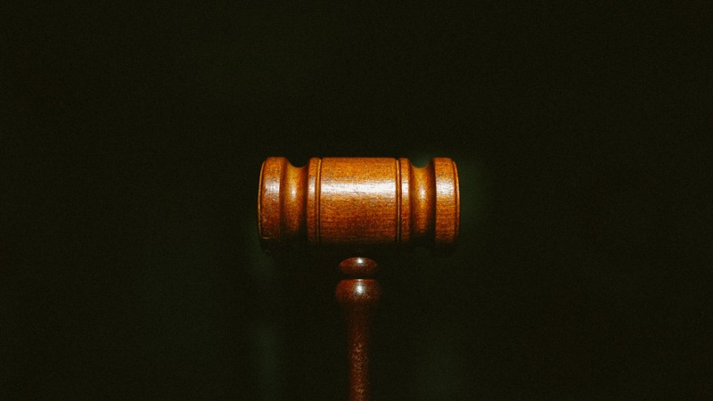 image of the judge mallet on black background