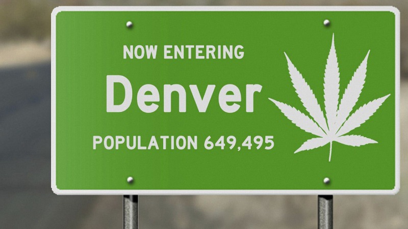 now entering denver road sign with cannabis icon in green background