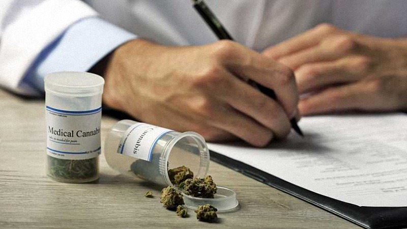 a doctor writing a prescribed medical cannabis