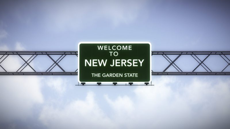 Welcome to New Jersey road sign with blue sky background