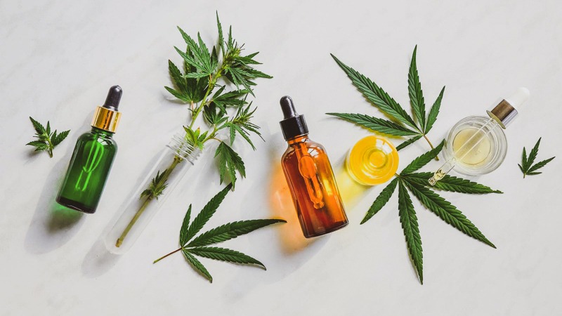 cbd oil products on a decorative background
