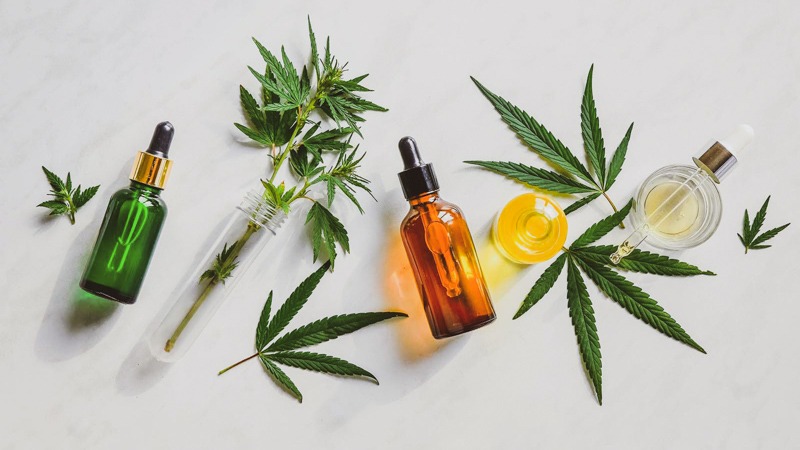 cbd oil products on a decorative background