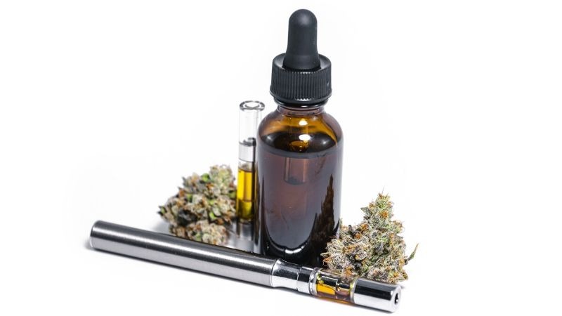 cbd oil and hemp flower with cbd vap pen on white background