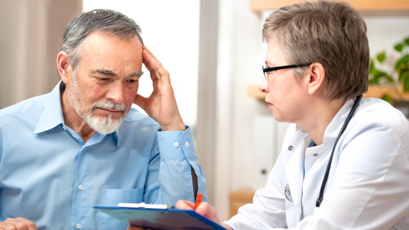 Doctor giving his patient prescription sedatives