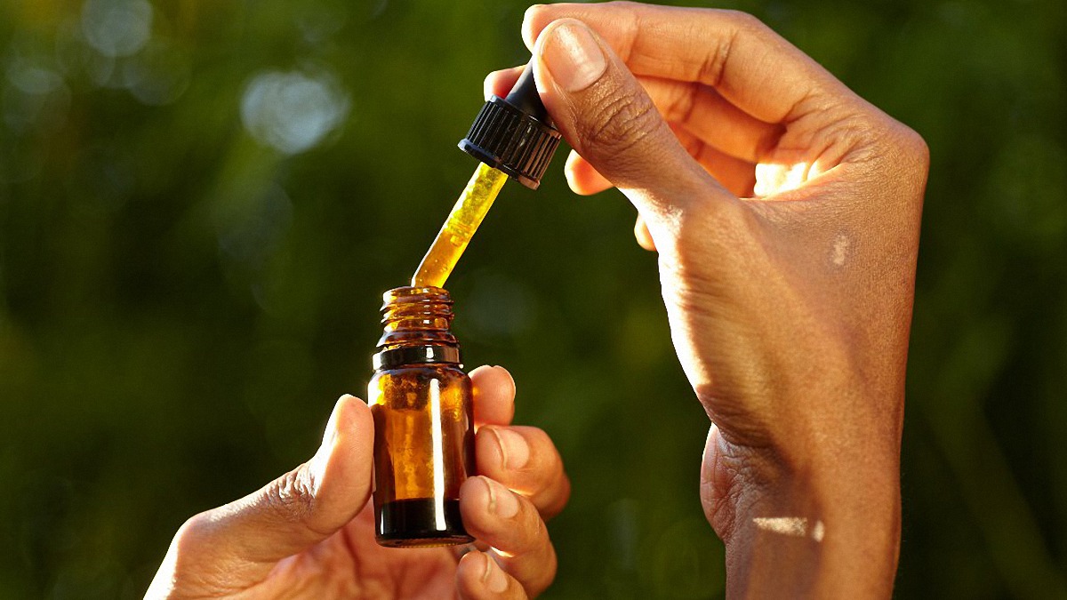 Hands Holding CBD Oil