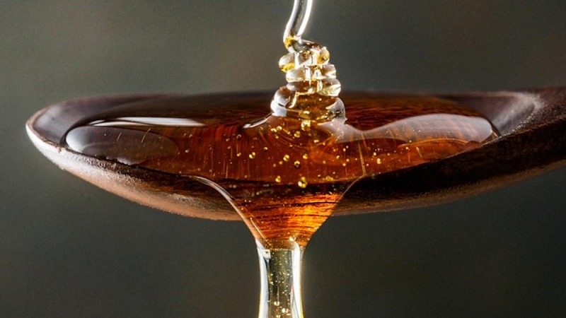 Honey in a Wooden Spoon