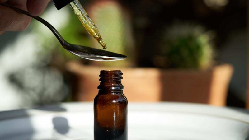 Putting some CBD Oil on the Teaspoon