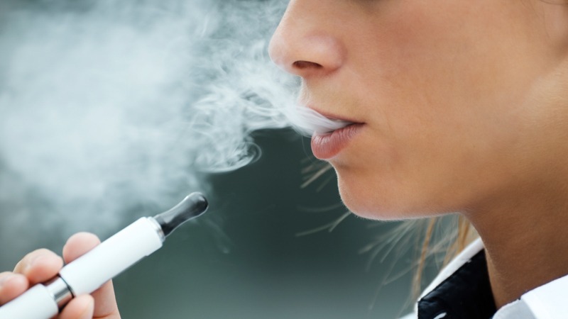 A Person Vaping CBD Oil