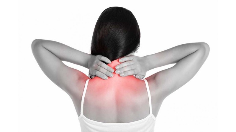 Woman Holding Her Back Neck with Pain