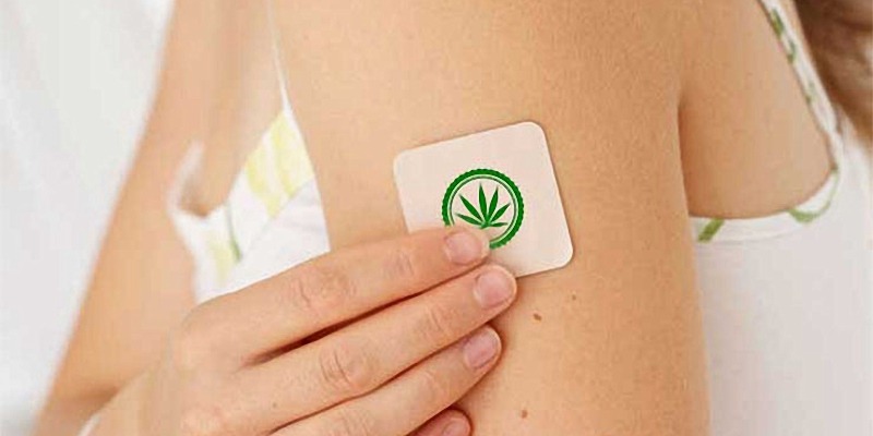 a woman using CBD patch on her arm